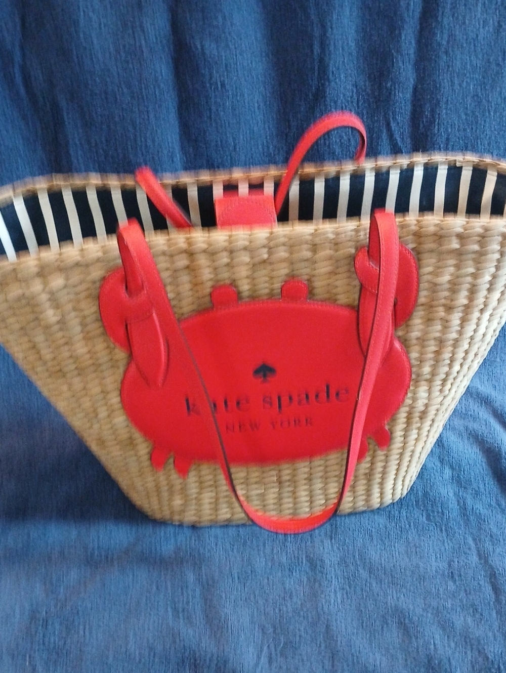 kate spade red straw tote with crab applique